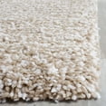 thumbnail image 3 of SAFAVIEH Ultimate Atanas Solid Plush Polyester Shag Area Rug, Sand/Ivory, 5' x 8', 3 of 5