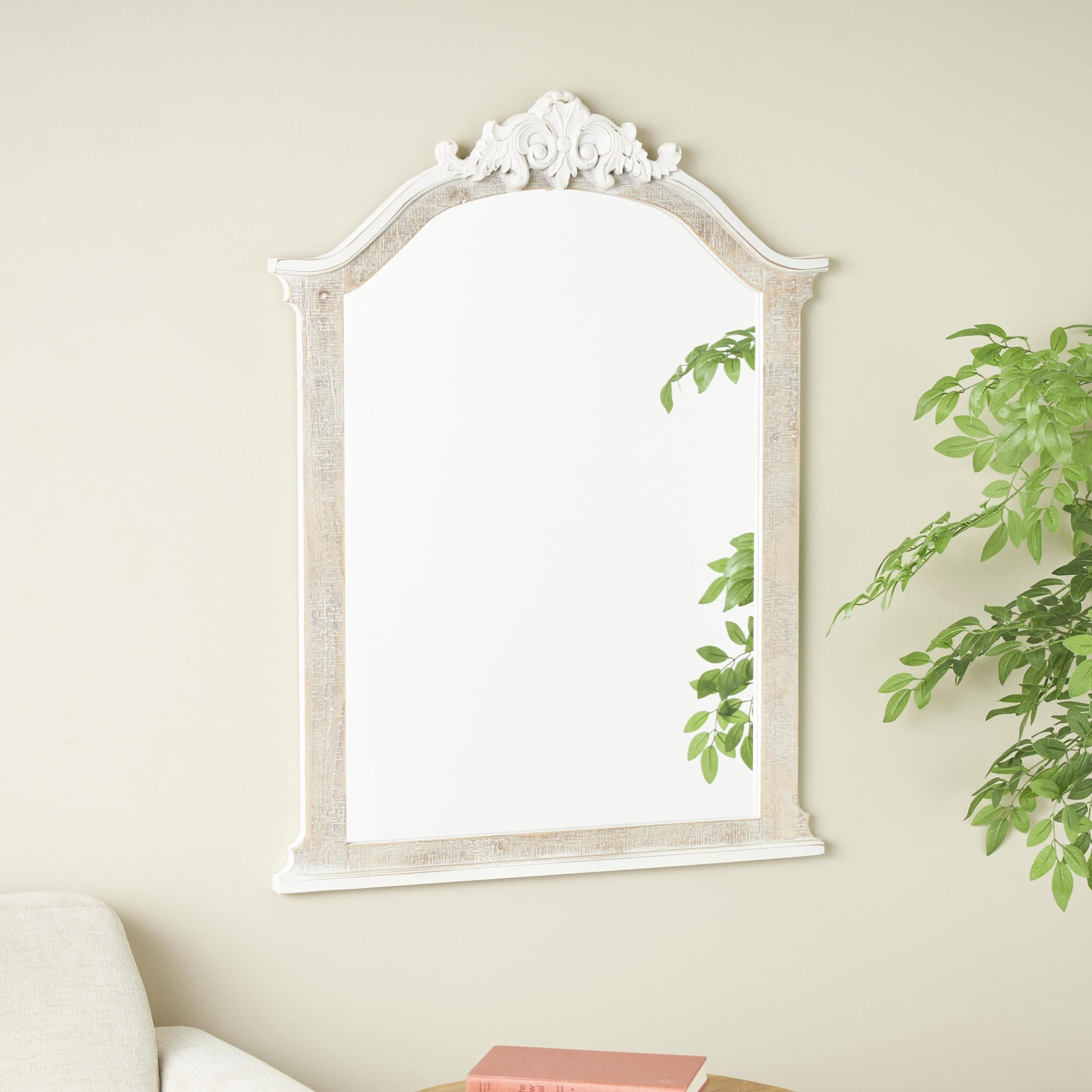 DecMode 28" x 37" Cream Arched Scroll Fleur De Lis Wall Mirror with Brown Distressing
