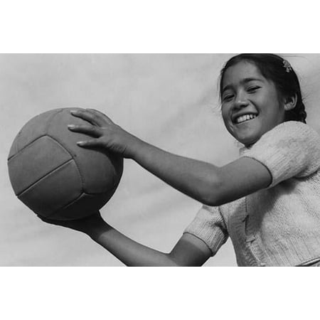 Girl and volley ball Manzanar Relocation Center California  Ansel Easton Adams was an American photographer best known for his black-and-white photographs of the American West  During part of his
