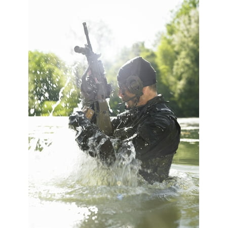 Special operations forces soldier emerges from water armed with a Steyr AUG assault rifle Stretched Canvas - Tom WeberStocktrek Images (13 x