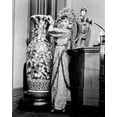 thumbnail image 1 of Anna May Wong stands by tall Chinese vase in period costume 8x10 inch photo, 1 of 1