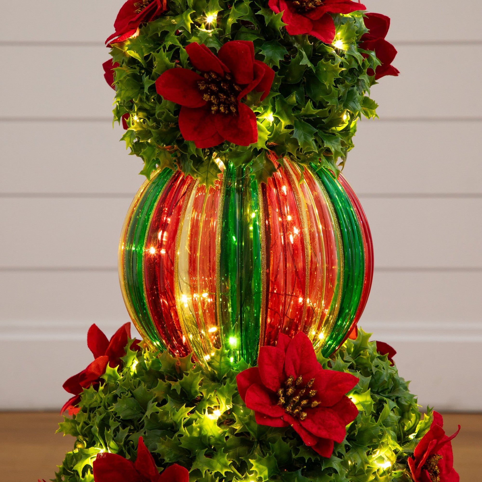3ft. Pre-Lit Artificial Christmas Ornament Holly Berry Topiary Tree with Poinsettias and 70 LED Lights in Decorative Urn