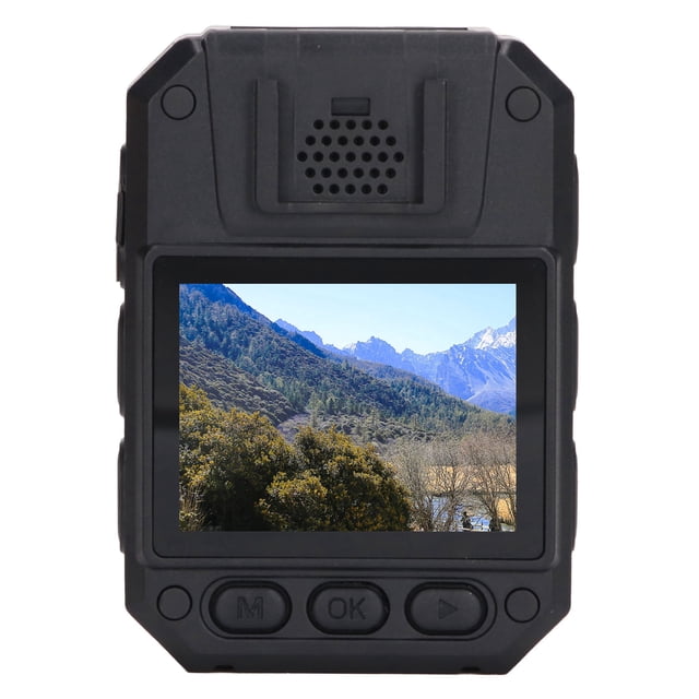 cámara corporal, minicámara corporal, cámara corporal, grabadora de video, construcción robusta Cámara corporal Nikou con vista frontal centrada; carcasa ABS negra de 80 x 55 x 28 mm, pantalla IPS a color de 2.0" que muestra paisaje; botones frontales (M, OK, play) y altavoz superior visibles. Lente gran angular incorporada >170°, visión nocturna IR que reconoce rostros hasta 6 m y contorno hasta 15 m, grabación AVI 1920 x 1080, almacenamiento integrado 32/64/128 GB opcional y batería de 3000 mAh para más de 8 h de grabación continua; adecuada para patrullaje, inspección industrial y ciclismo.