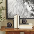 thumbnail image 2 of CosmoLiving by Cosmopolitan 7" Orb 7 lbs Black Marble Bookends (Set of 2), 2 of 7