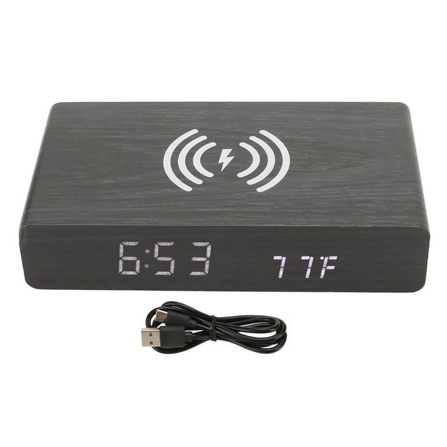 Reloj digital de madera negra con luz LED blanca y carga inalámbrica para dormitorio.