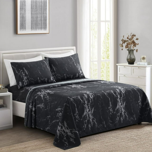 Modern black marble pattern ultra soft silky rayon from bamboo sheet set with deep pockets and matching pillowcases on a bed in bright room.