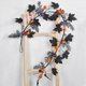 thumbnail image 5 of Guirnalda de Hojas Negras para Halloween, Enredadera Floral de Plástico de 59 Pulgadas con Flores Negras para Decoración de Fiestas Espeluznantes, Repisas, Puertas y Escaleras., 5 of 6