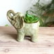 thumbnail image 2 of Maceta con forma de elefante de cerámica con diseño floral en relieve, 2 of 3