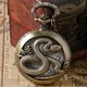 thumbnail image 1 of Reloj de bolsillo vintage de cuarzo antiguo con diseño de serpiente y collar con grabado del zodíaco, 1 of 4