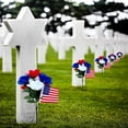 thumbnail image 4 of Le Cimetière Utilise des Paquets de Fleurs pour Créer des Fleurs Artificielles Rouges, Bleues et Blanches pour les Journées Commémoratives. Ces Fleurs Sont Utilisées pendant la Journée des Anciens Combattants et le Jour de l'Indépendance au Cimetière, 4 of 9