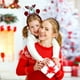 thumbnail image 4 of Diadema navideña iluminada con diseños de Papá Noel, muñeco de nieve, oso y ciervo | Diadema LED festiva para adultos y niños | Accesorio para fiestas navideñas, 4 of 5