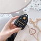 thumbnail image 2 of Bonita funda para Airpods, funda de silicona 3D para mochila Airpods con llavero y correa de metal diseñada para Apple AirPods 1 y 2 (negro) oso de fresa Electrónica, 2 of 5