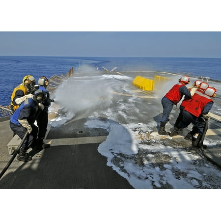 Team Practice Drills LAMINATED POSTER Sailors from the flight deck firefighting team practice firefighting techniques during drills aboar Poster Print 24 x 36 ()