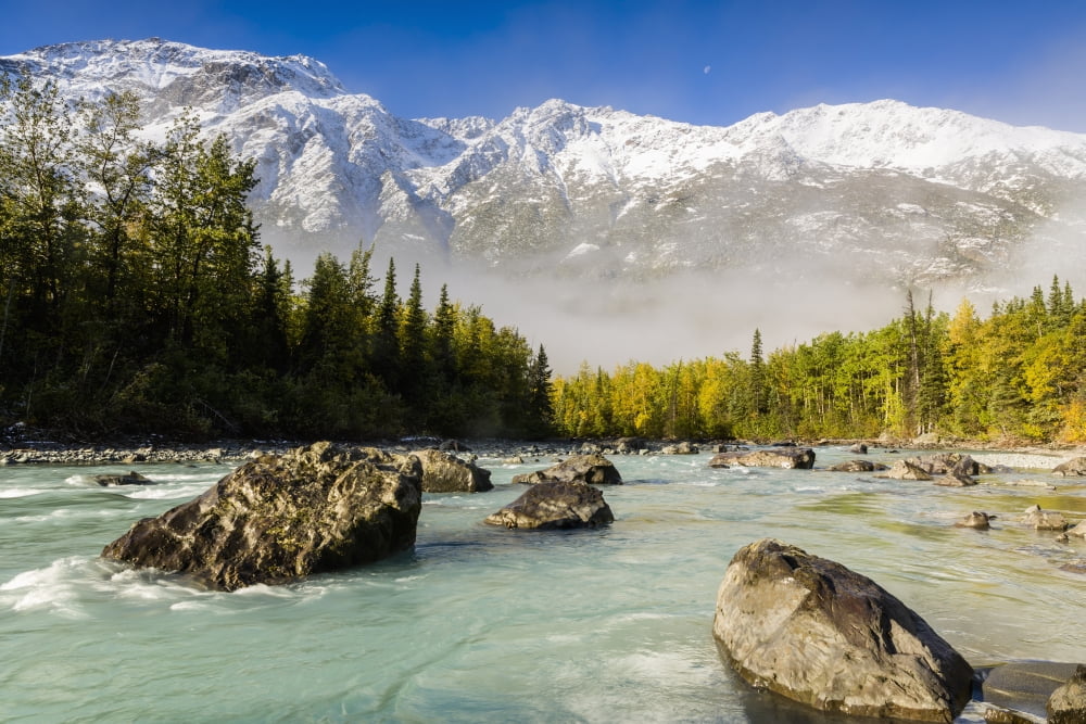 Autumns colors contrast with winters first snow in the Chugach Mountains overlooking Eagle River Valley at the Rapids in Chugach State Park in Southcentral Alaska Canvas Art - Ray Bulson Design Pics
