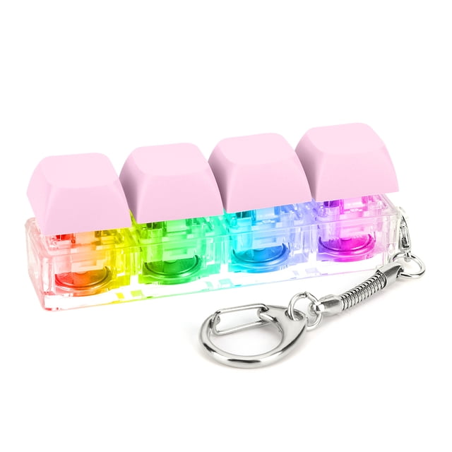 botón estrés alivio keyboard clicker tequeno descopresión tejes teclado del teclo telecha fidge 4 techas con led light diy para suminis — Vista 3/4 frontal de un llavero fidget con cuatro caps rosadas en base transparente; mecanismos internos y LEDs multicolor visibles, aro metálico con cadena tipo resorte, tamaño portátil; a menudo usado como opción de regalo para familiares.