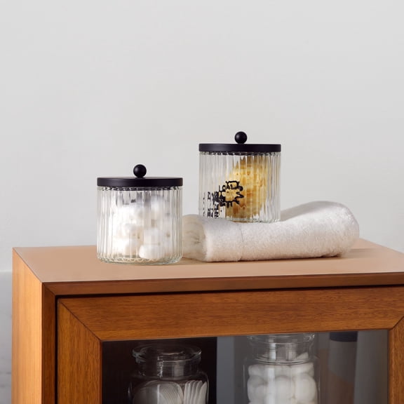 KMwares 2-Pack Glass Qtip Holder Dispenser Set - Bathroom Canister Storage Organizer for Cotton Balls, Swabs, Floss Picks, and Makeup Sponges with Matte Black Metal Lid - Clear Vanity Apothecary Jars