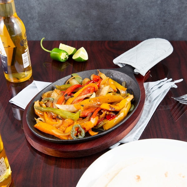 Choice 9 1/4" x 7" Oval Cast Iron Fajita Pan Set with Mahogany Wood