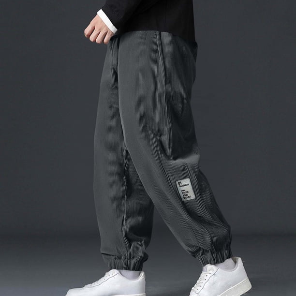 Pantalones largos para hombre, color liso, holgados, informales, con bolsillo, cordón ajustable, cintura elástica, pantalones deportivos de poliéster para hombre.