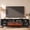 Black, variant on Sonegra Fireplace TV Stand with 36" Electric Fireplace, Mid Century Modern Entertainment Center with Led Lights for 80" TVs , Wood Media Console with Slatted Sliding Doors for Living Room, Brown