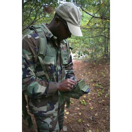 A military technician uses a PDA to wirelessly test and monitor nearby electronic devices Stretched Canvas - Michael WoodStocktrek Images (12 x