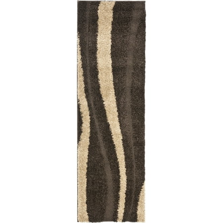 Safavieh SAFAVIEH Willow Shag SG451-2813 Dark Brown / Beige Rug SAFAVIEH Willow Shag SG451-2813 Dark Brown / Beige Rug The sandy shores of sunny Miami Beach are the inspiration for this plush Florida shag by SAFAVIEH. A high-low pile of cut and looped yarns makes for an alluring  soft textured shag that is a comforting pleasure to the senses. This sculpted shag rug is power-loomed using synthetic fibers making it an ideal choice for busy areas of the home or office. Rug has an approximate thickness of 1.2 inches. For over 100 years  SAFAVIEH has set the standard for finely crafted rugs and home furnishings. From coveted fresh and trendy designs to timeless heirloom-quality pieces  expressing your unique personal style has never been easier. Begin your rug  furniture  lighting  outdoor  and home decor search and discover over 100 000 SAFAVIEH products today.