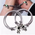 thumbnail image 2 of Set 2 Pulseras Para Parejas Imán Astronauta Brilla Oscuridad Modelo Gris, 2 of 4