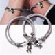 thumbnail image 2 of Set 2 Pulseras Para Parejas Imán Astronauta Brilla Oscuridad Modelo Gris, 2 of 4