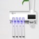 thumbnail image 1 of Dispensador automático de pasta de dientes estante de almacenamiento de cepillo de dientes montado en la pared para baño, 1 of 8