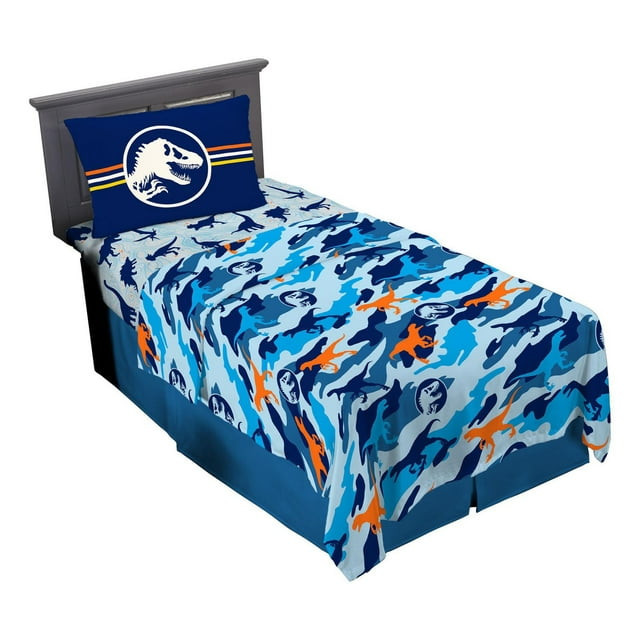 Jurassic 'Blue Point of View' twin sheet set with blue, navy, and orange dinosaur silhouettes on the sheets and a pillowcase displaying a white T-Rex logo on dark blue background.