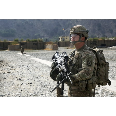 July 28 2013 - US Army soldier provides overwatch at the airfield during a key leader engagement on Forward Operating Base Bostic Nuristan province Afghanistan Poster