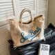 thumbnail image 4 of Bolso de mujer de gran capacidad, superventas 2024, bolso de hombro de lona de color sólido a la moda, bolso de mano de alta calidad con borlas y letras, 4 of 5