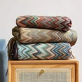 thumbnail image 3 of Fennco Styles Blue Zigzag Soft Boho Throw Blanket with Tassel 50" W x 60" L - Colorful Crochet Chevron Tapestry Blanket for Indoor Outdoor Use, Couch, Bedroom, Living Room, Office Décor, 3 of 5