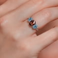 thumbnail image 4 of Gem Stone King 10K White Gold Red Garnet Persian Blue Moissanite and White Lab Grown Diamond 3 Stone Engagement Ring for Women (2.48 Cttw, Gemstone Birthstone, Size 9), 4 of 5