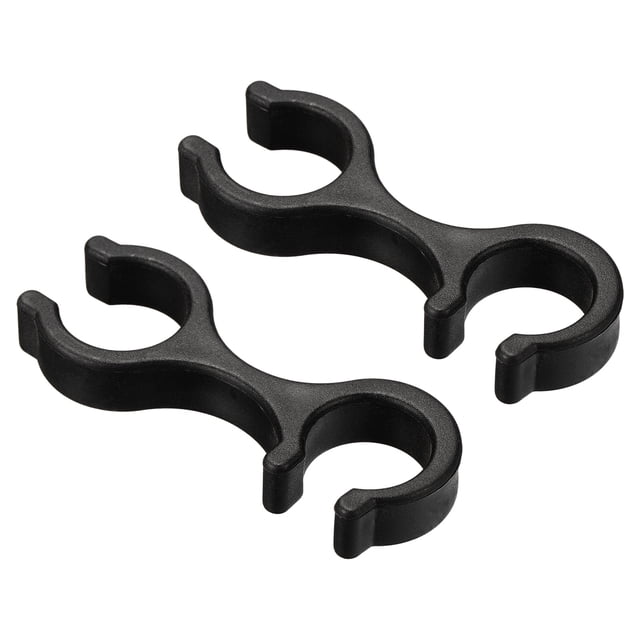 Unique Bargains Double Rod Buckle Connector Walking Stick Accessories Trekking Pole Clips 2 Pack. Black trekking pole clips made of durable engineering plastics, designed to stabilize trekking poles during hiking or outdoor activities. Lightweight and compact, ideal for trekking pole accessories and hiking gear, suitable for use in mud, snow, and various terrains.
