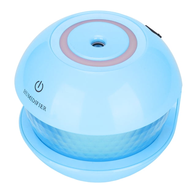 portable humidifier, delicate spray usb charging silent cool mist humidifier for home for office Front-facing close-up of a small round blue portable humidifier with dome top and central mist nozzle, power icon and label "HUMIDIFIER" on the shell, textured translucent midsection water tank, single-button control and visible color-gradient nightlight ring; suitable for desktop or car use, 150 ml tank and USB 5V charging, continuous or intermittent spray modes per specs; often used as a compact nightlight-humidifier for bedside or travel.