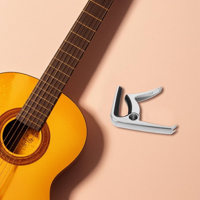 unbranded 1Jgo Capo Para Guitarra Acústica Y Eléctrica De Aleación De Zinc Con Pinzas Y Púas Multiusos Plata