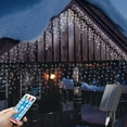 thumbnail image 1 of mimigogo 300 luces LED solares para exteriores con control remoto, 33 pies, 8 modos, cadena de luces con 50 gotas, decoración navideña, bodas, fiestas, color blanco, 1 of 5