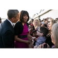 thumbnail image 2 of First Lady Michelle Obama Reacts While Talking With People Along A Rope Line. She And President Barack Obama Were At, 2 of 2