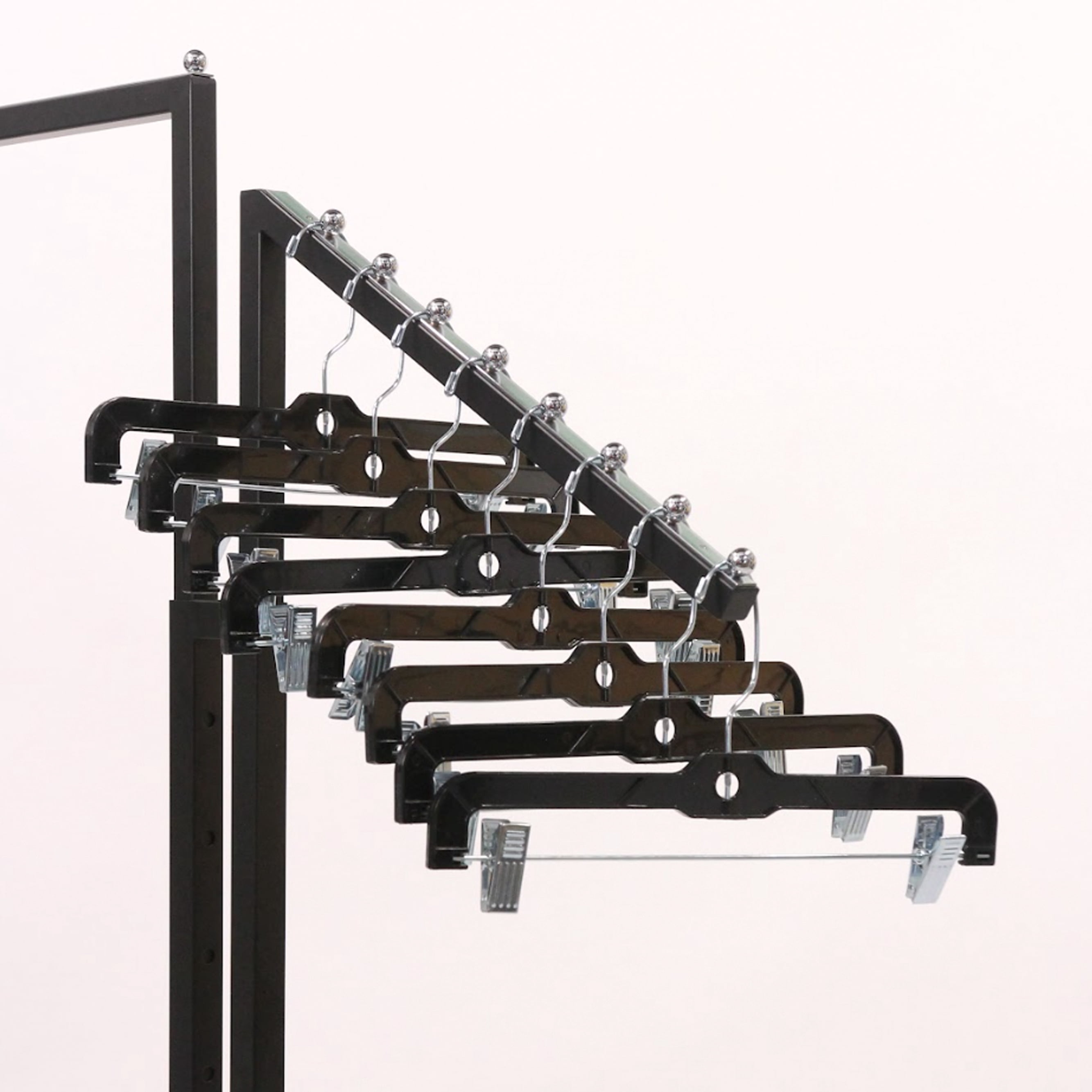 SSWBasics 14-Inch Black Plastic Skirt and Pants Hangers - Pack of 20 with Chrome Swivel Hook  Padded Clips - Perfect for Retail and Home Use  Holds Up To 6 Pounds