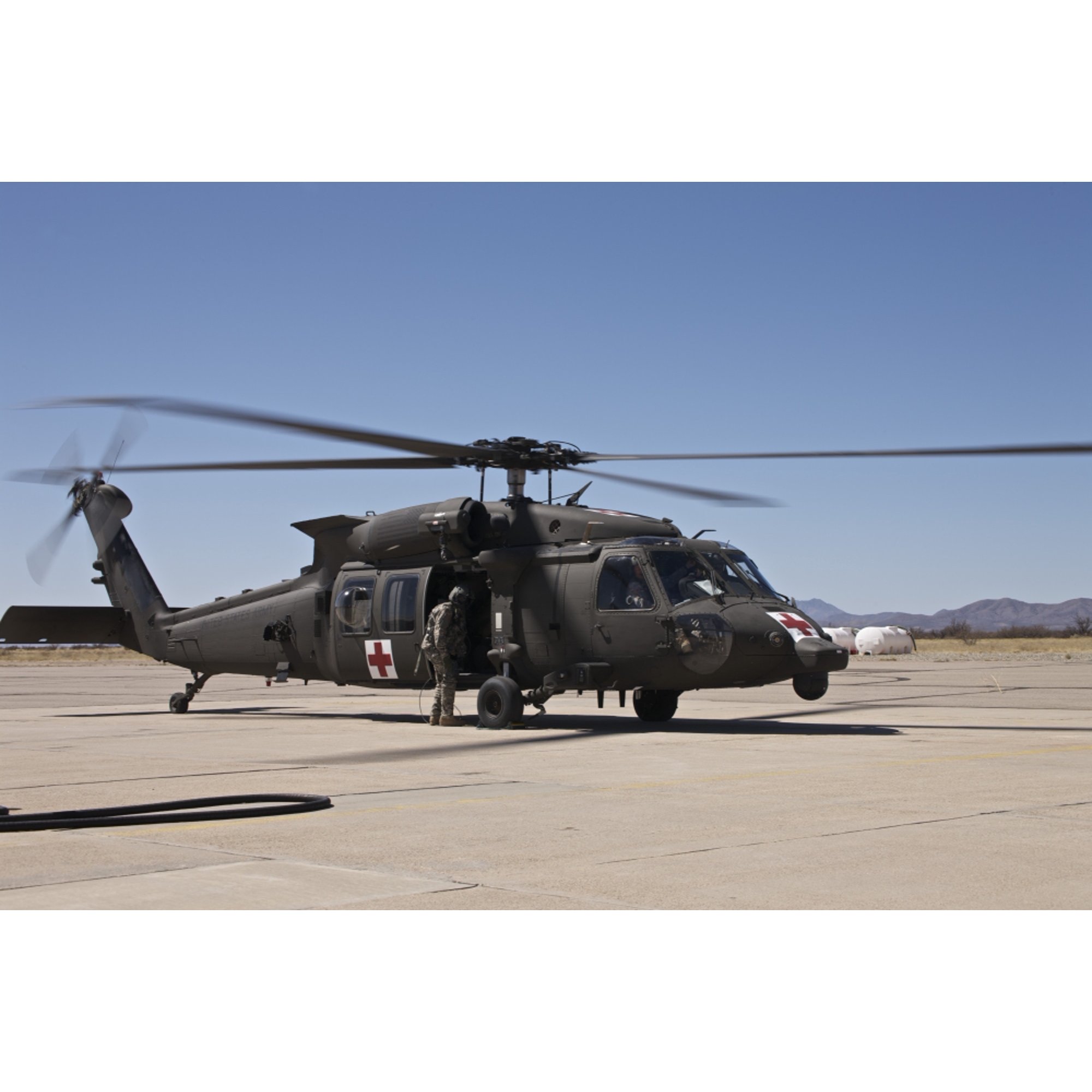 A UH-60 Blackhawk helicopter at Davis-Monthan Air Force Base Canvas Art - Terry MooreStocktrek Images (18 x 12)
