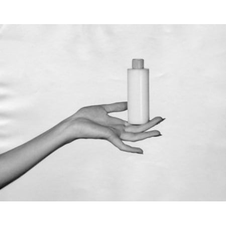 Close-up of a womans hand holding a bottle of moisturizer Canvas Art - (24 x 36)