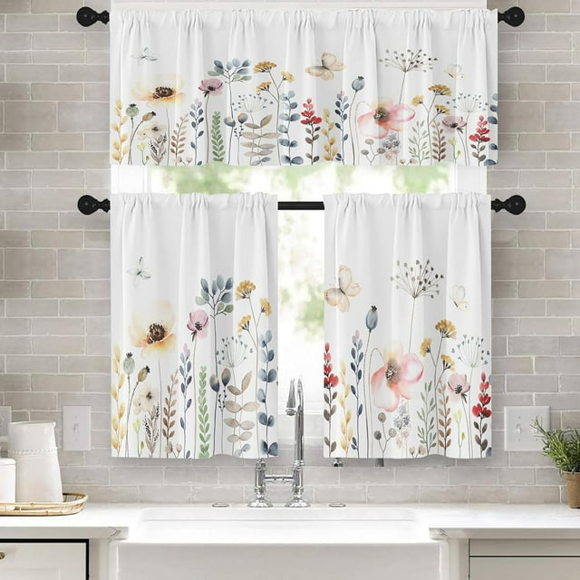 Watercolor Floral Kitchen Curtains Window Curtains Valance and Tier Set 36 Inch displayed in a kitchen setting. The set includes a valance measuring 52 x 18 inches and two tier curtains, each 26 x 36 inches. The curtains feature a colorful design of wildflowers and butterflies on a white background, adding a spring-inspired touch. Made of 100% polyester, the material is soft, wrinkle-resistant, and machine washable. The rod pocket design allows for easy installation, and the curtains provide privacy and light reduction. Suitable for kitchen decor or other rooms like living rooms and bedrooms.