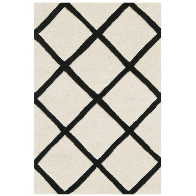 Safavieh Chatham Isaac area rug featuring bold black geometric diamond shapes on an off-white background.