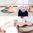 thumbnail image 4 of 20 piezas de perchas para bebés, perchas para ropa de niños, perchero de plástico para ropa de bebé, perchas de plástico para ropa, para camisetas de bebé, suéteres, pantalones (rosa, blanco) TUNC Sencillez, 4 of 5