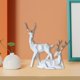 thumbnail image 5 of 1 par de estatuas geométricas de ciervos, esculturas de alces de animales, artesanías de resina hechas para escritorio, sala de , mueble B_Blanco Macarena Estatua de ciervo, 5 of 8