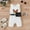 White, variant on XDZJLR Girls Rompers Toddler Sleeveless Crewmecl Solid Color Print Ribbed Belt Waist Bag Outfit Black 9-12 Months