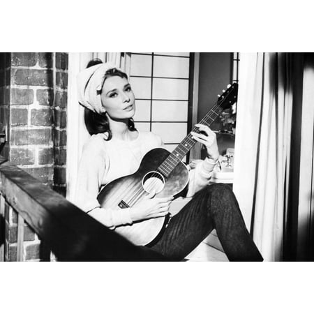 Audrey Hepburn in Breakfast at Tiffany's 24x36 Poster playing (Best Headphones For Playing Guitar)