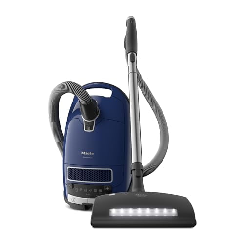 Aspiradora de trineo Miele Complete C3 Marin con bolsa y cabezal electrocepillo, apta para alfombras y suelos duros, en azul marino.