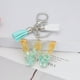 thumbnail image 2 of Llavero de letras con borlas verdes | Colgante de cristal acrílico | Lámina de oro, pegamento en gota, joyería de piedra engrosada | Amuleto de bolso con estilo, accesorio para mochila | 1 pieza, 2 of 2