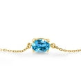 thumbnail image 2 of Gem Stone King 18K Yellow Gold Plated Silver Swiss Blue Topaz Solitaire Bracelet for Women (1.50 Cttw, Oval 8X6MM, Gemstone November Birthstone, Fully Adjustable up to 9 inch), 2 of 3